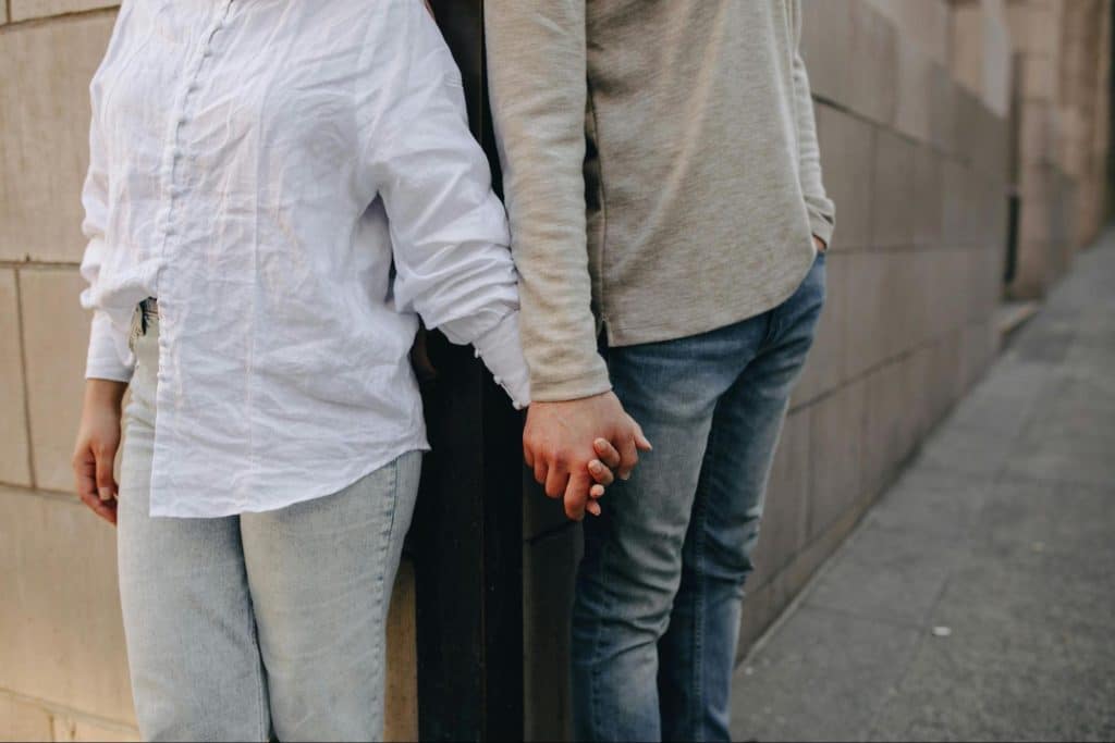 A man and woman holding hands