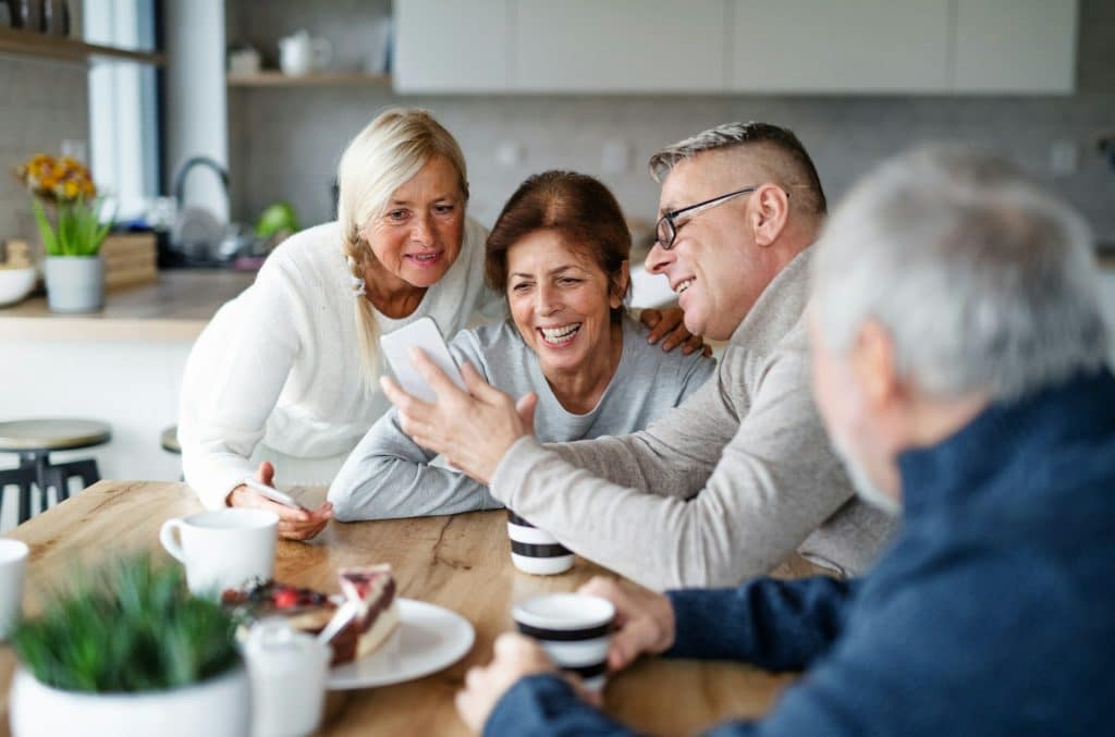 A group of friends talking at the table.