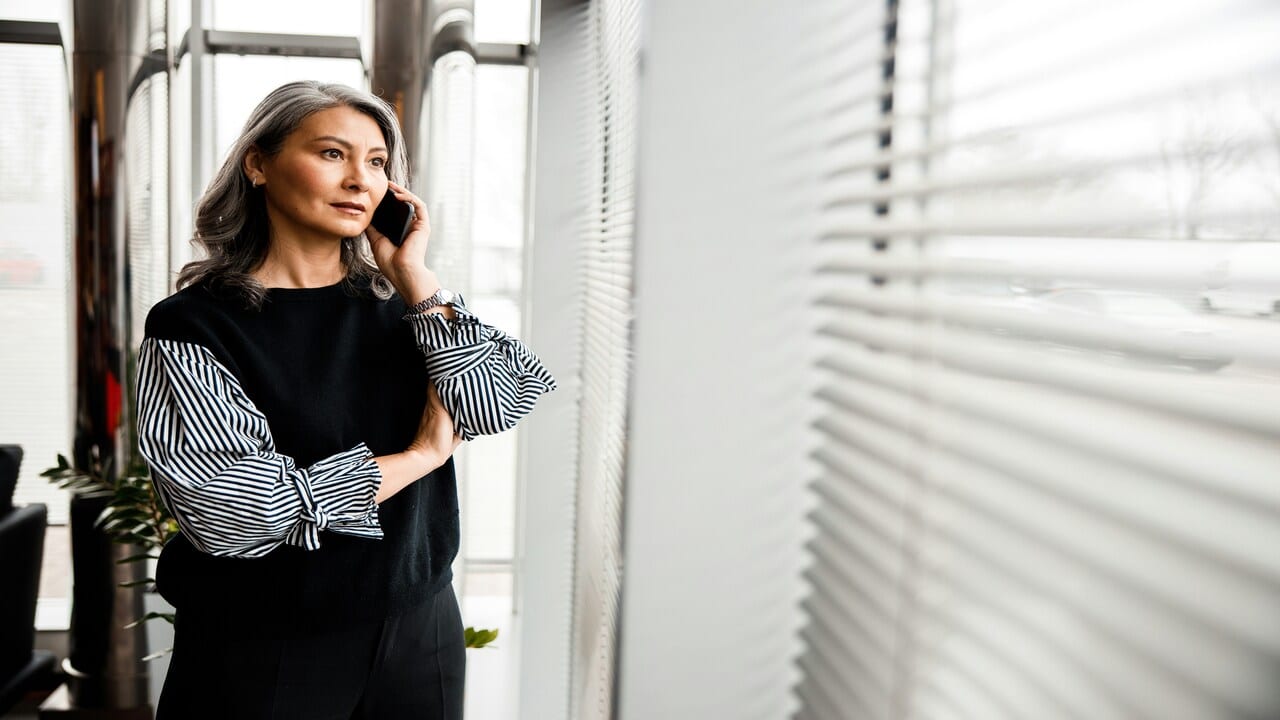 A beautiful mature woman on the phone