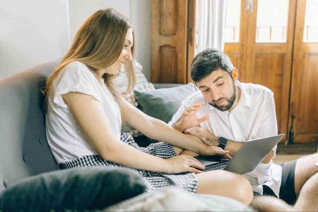 A woman trying to show something to a man