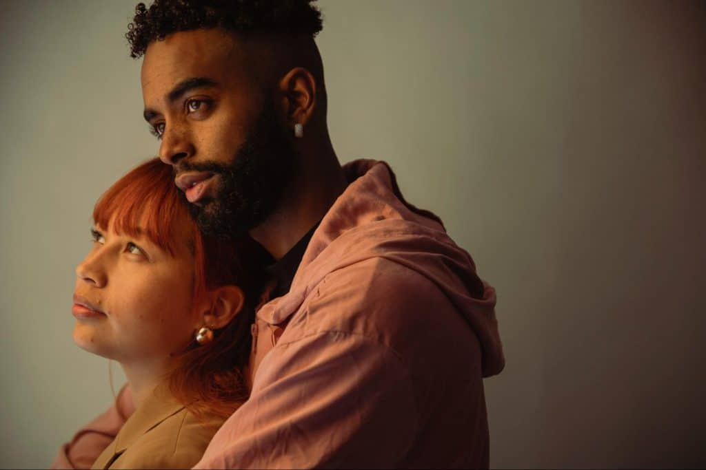 A man hugging a woman