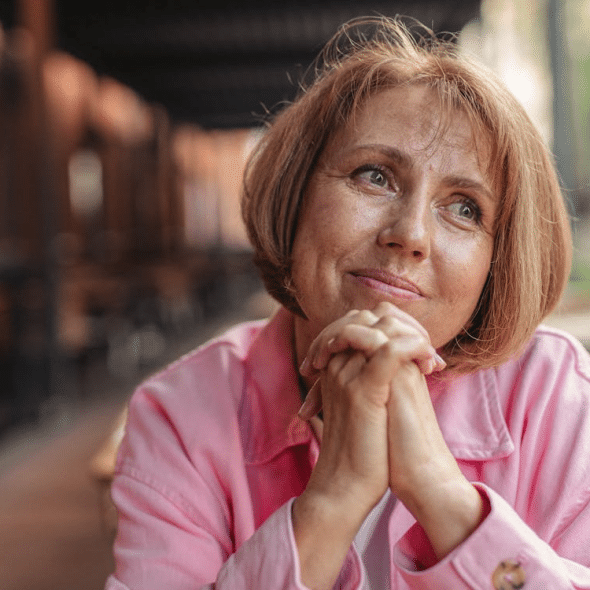 A woman in a pink jacket
