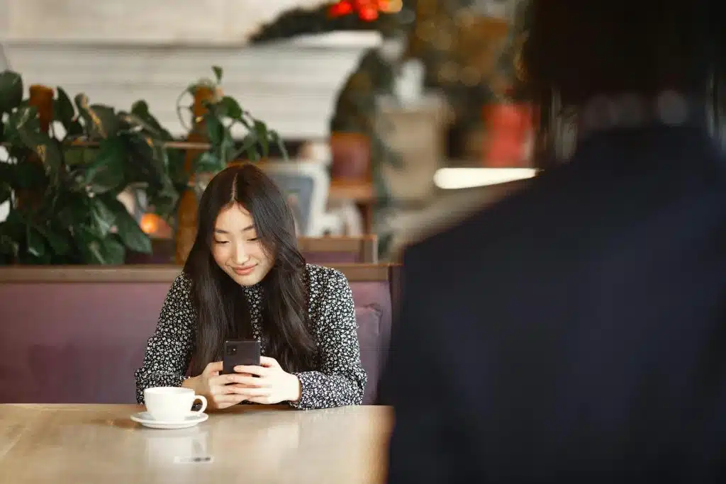 A woman using her phone.