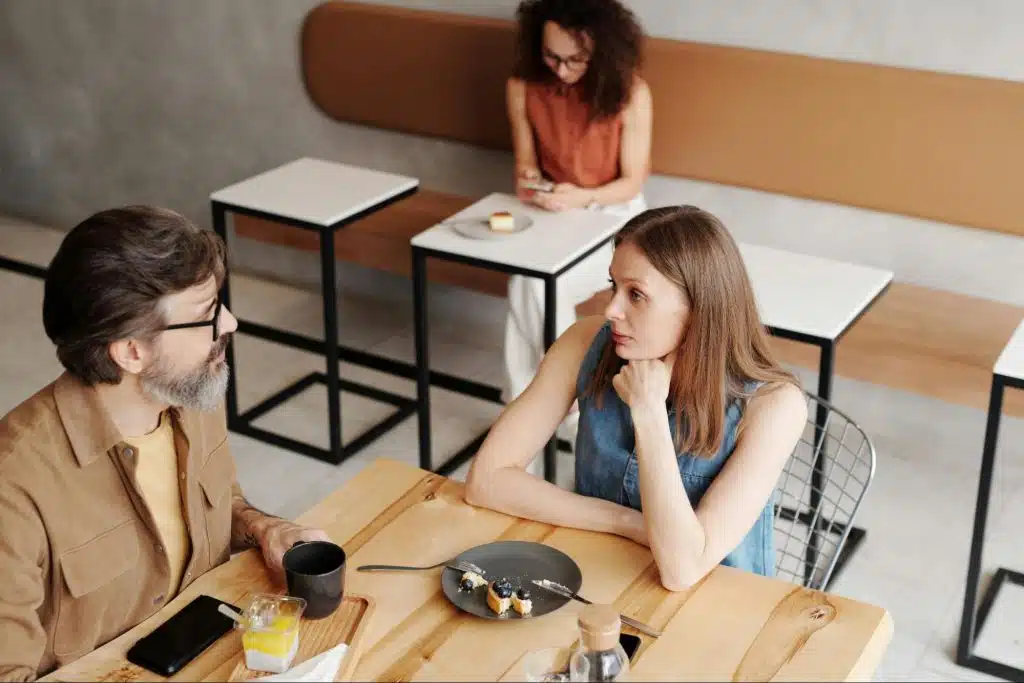 A man and woman having a calm disagreement
