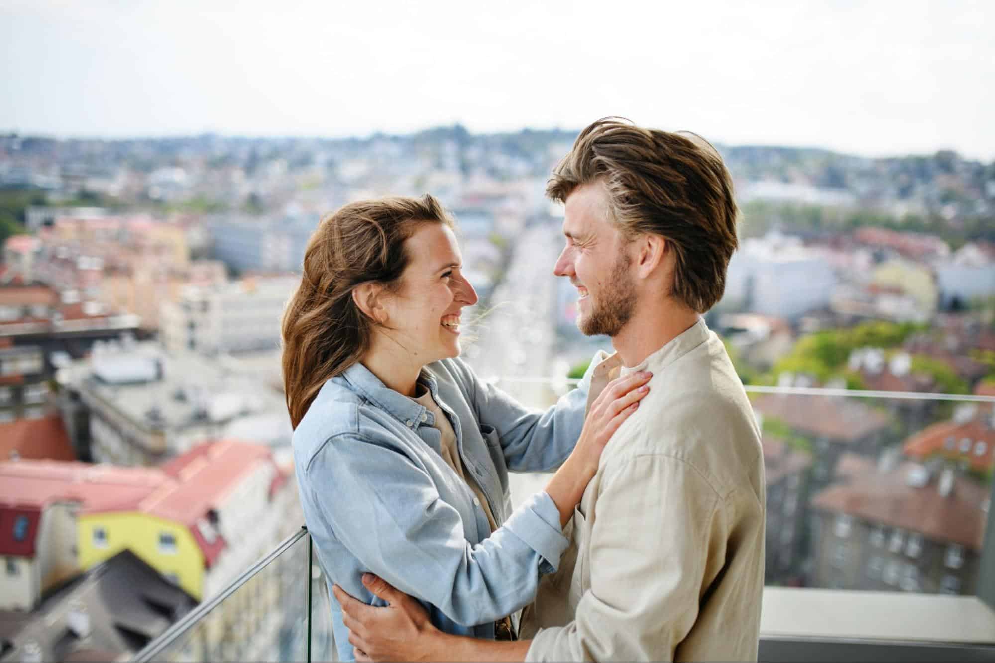 A man and woman smiling at each other
