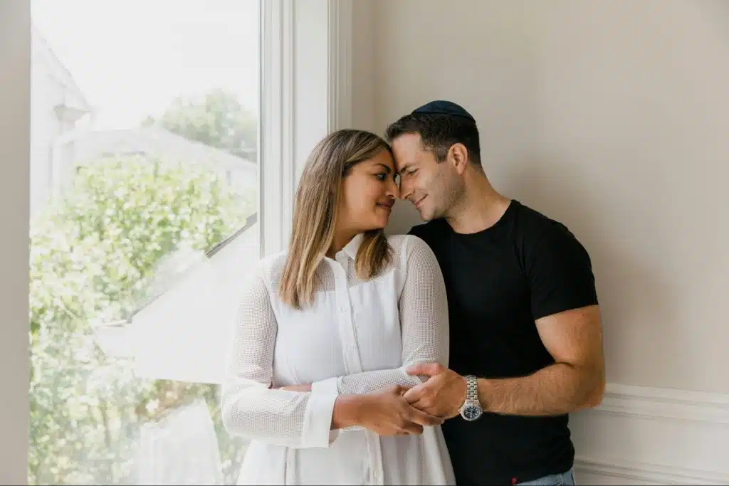 A man and woman smiling at each other 