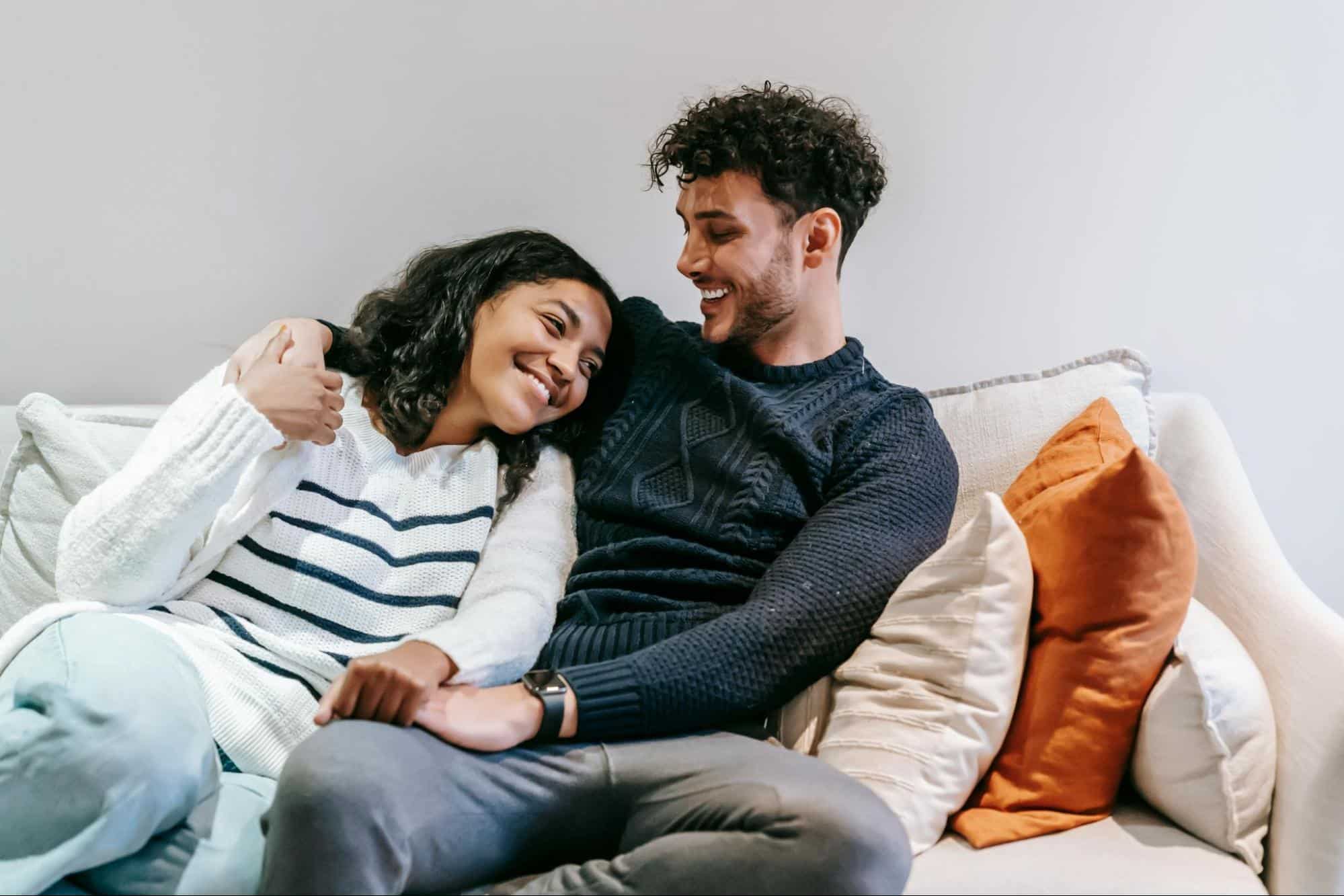 A man and woman at the couch