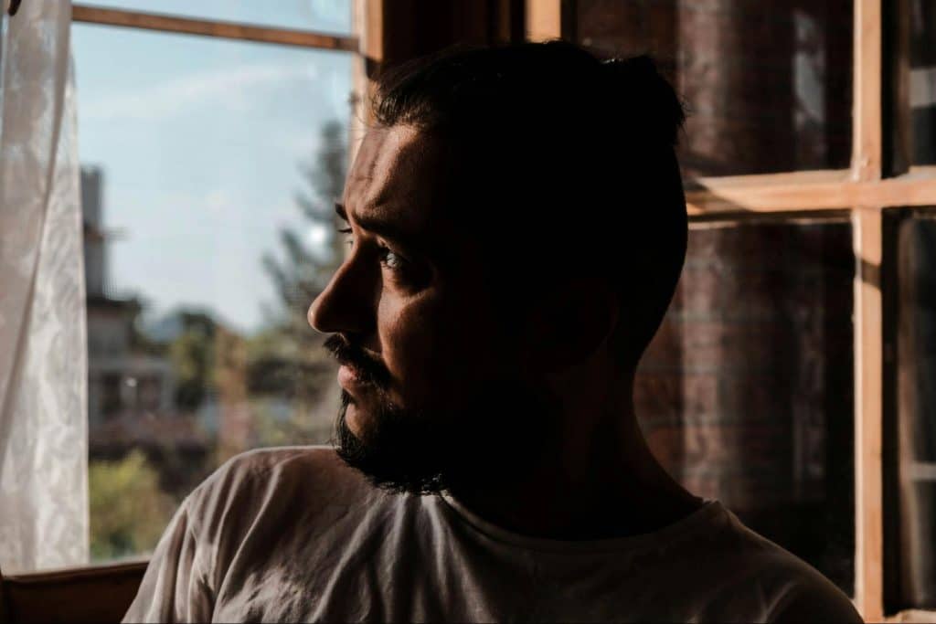 A man looking outside the window
