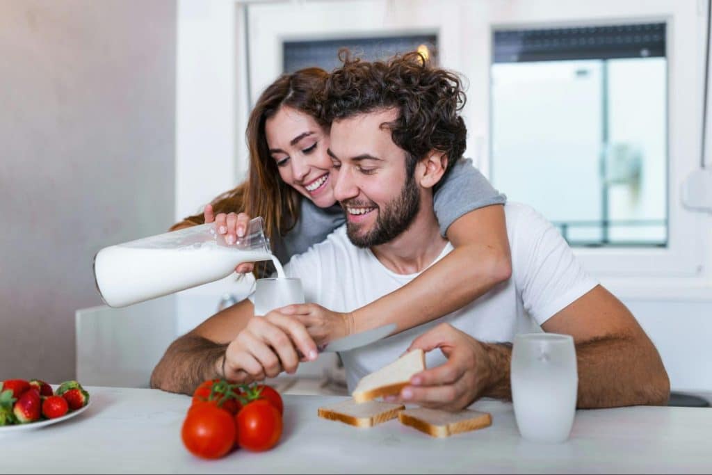 A man and woman at the kitchen