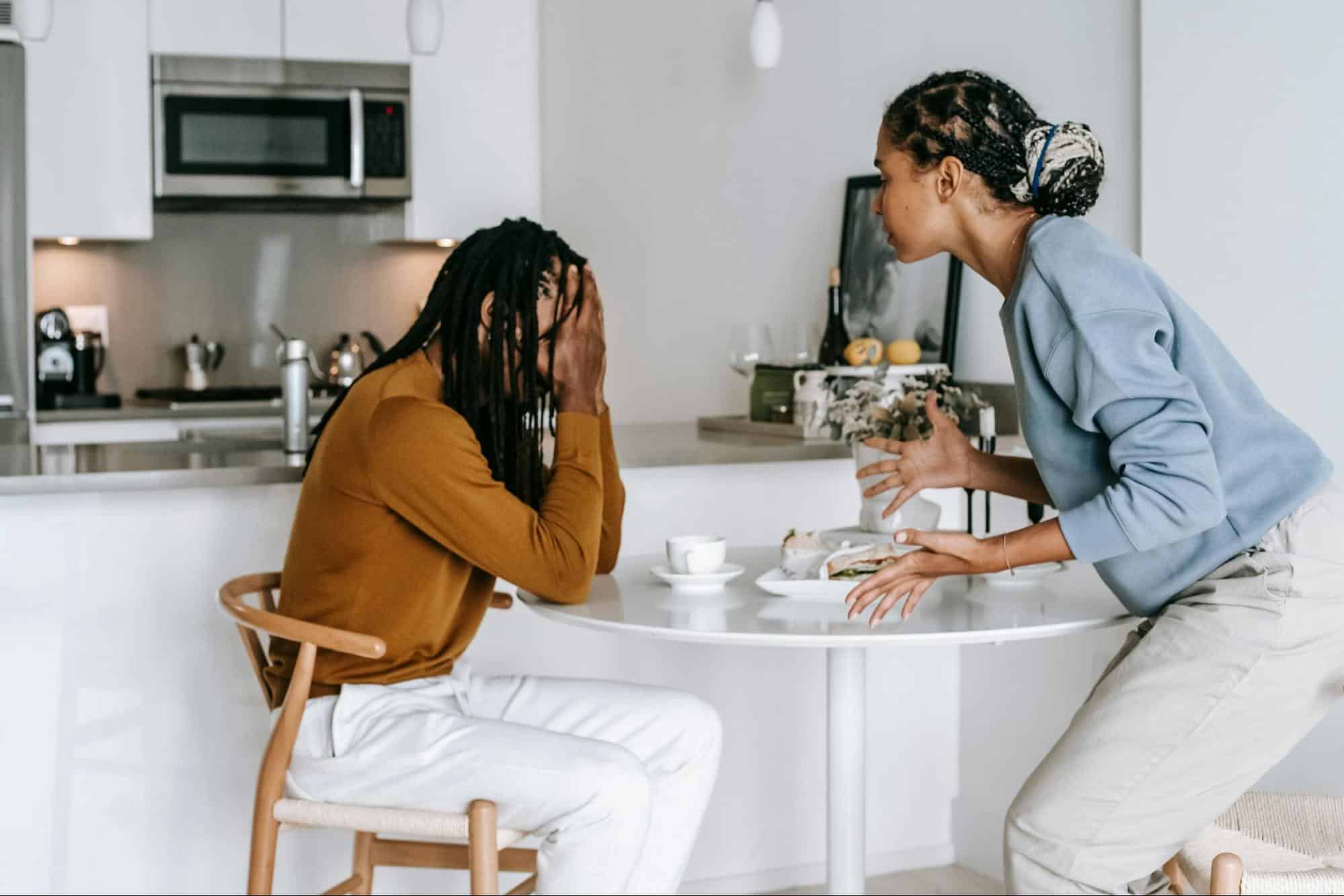 A woman questioning a man
