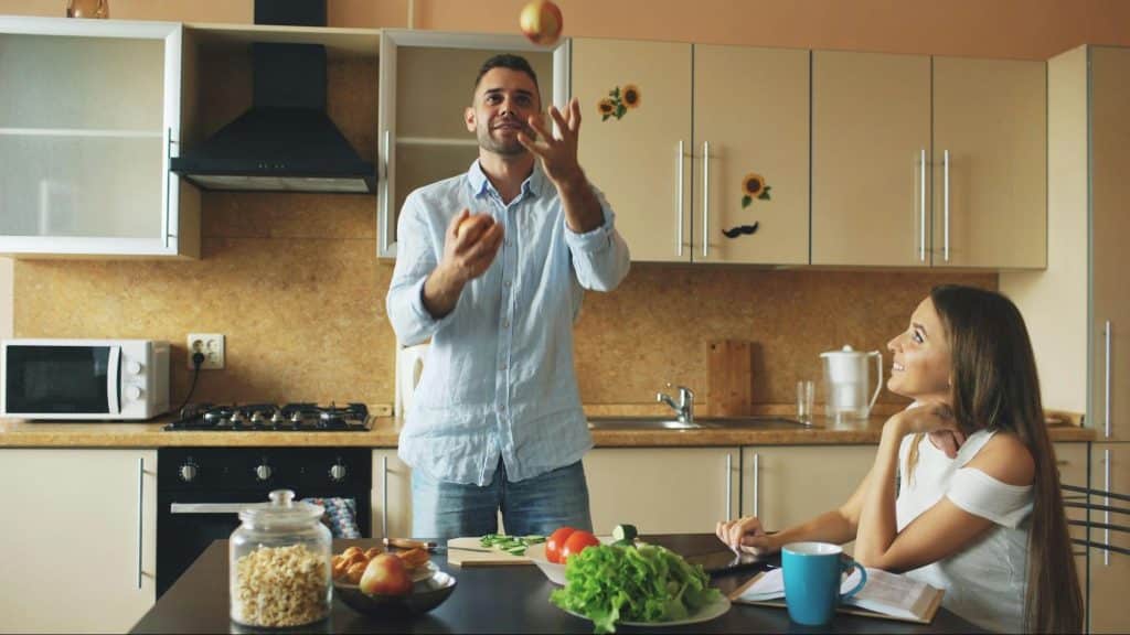 A man entertaining a woman