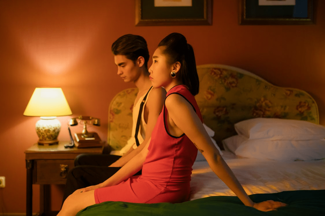Couple sitting on the bed