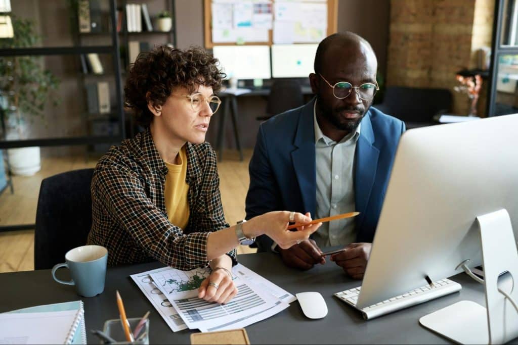 A man and woman stressed with their work 