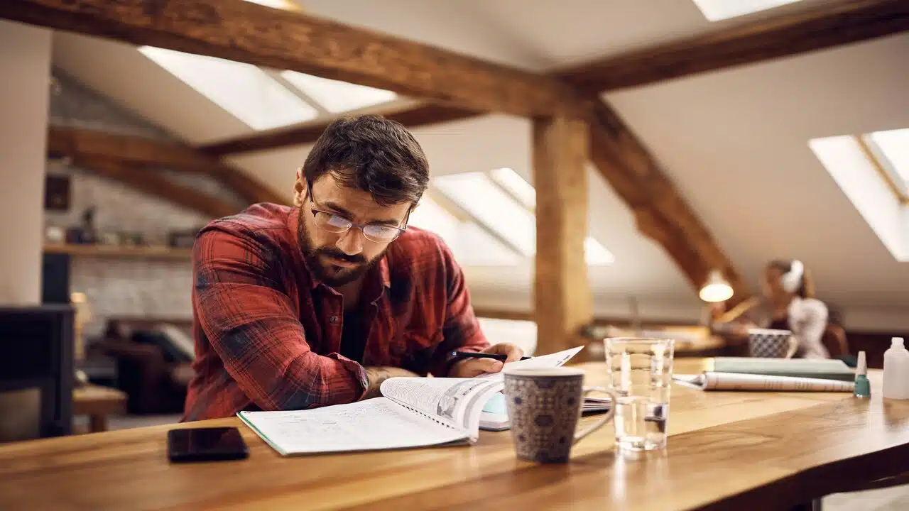 A man studying by himself