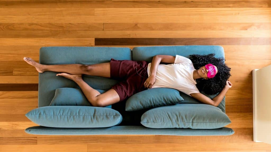 A woman sleeping on the couch