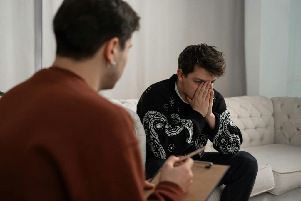 A man talking with his friend about the break-up