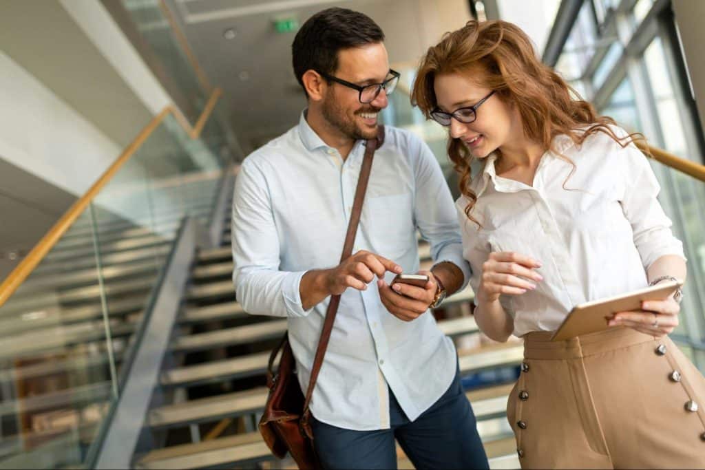 A woman just looking at what the man showing to her