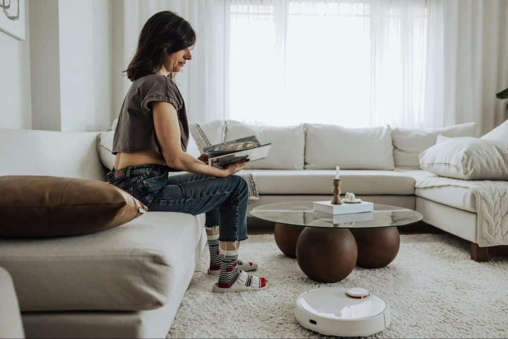 A woman sitting alone at the living room