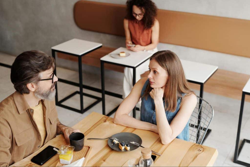 A man and woman having a calm disagreement