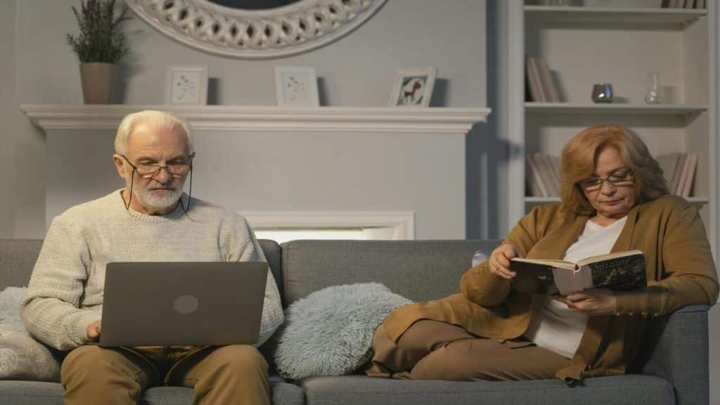 A couple both busy at home