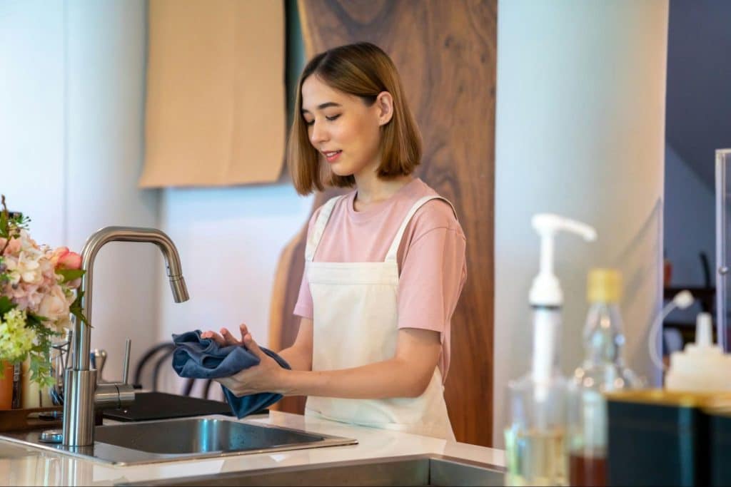 A woman at the kitchen