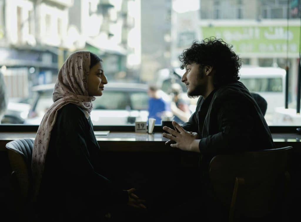 A man and woman talking