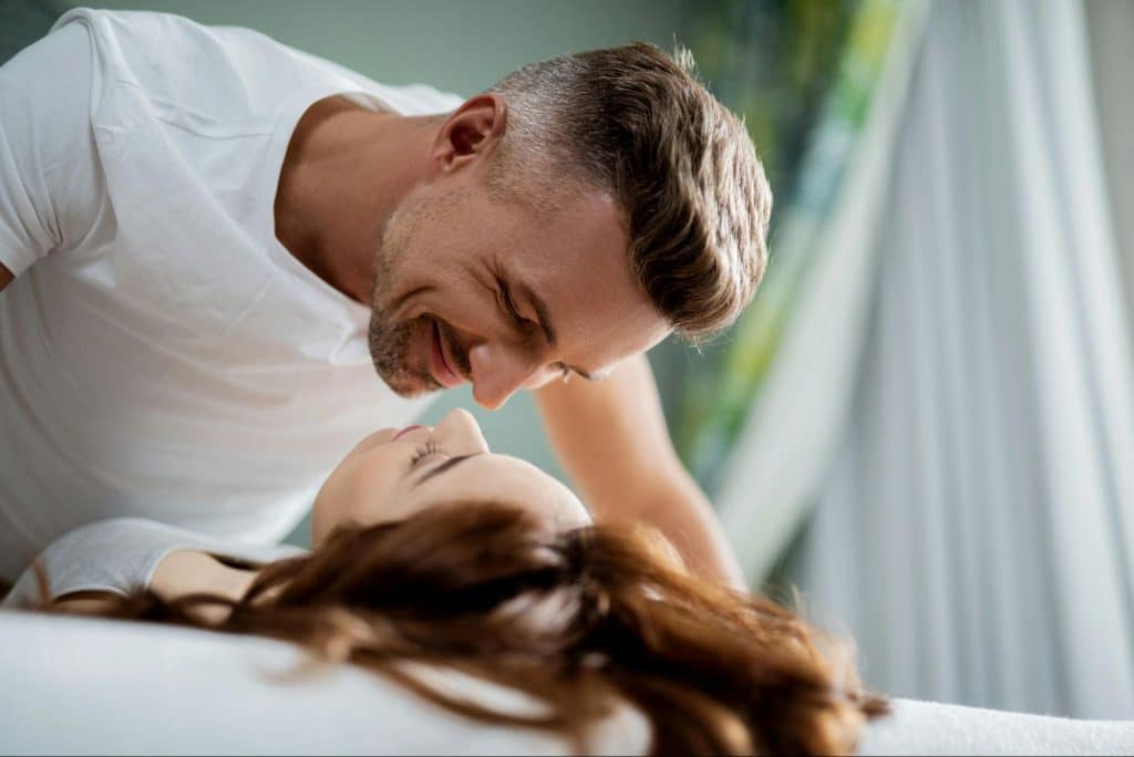 A man and woman smiling at each other