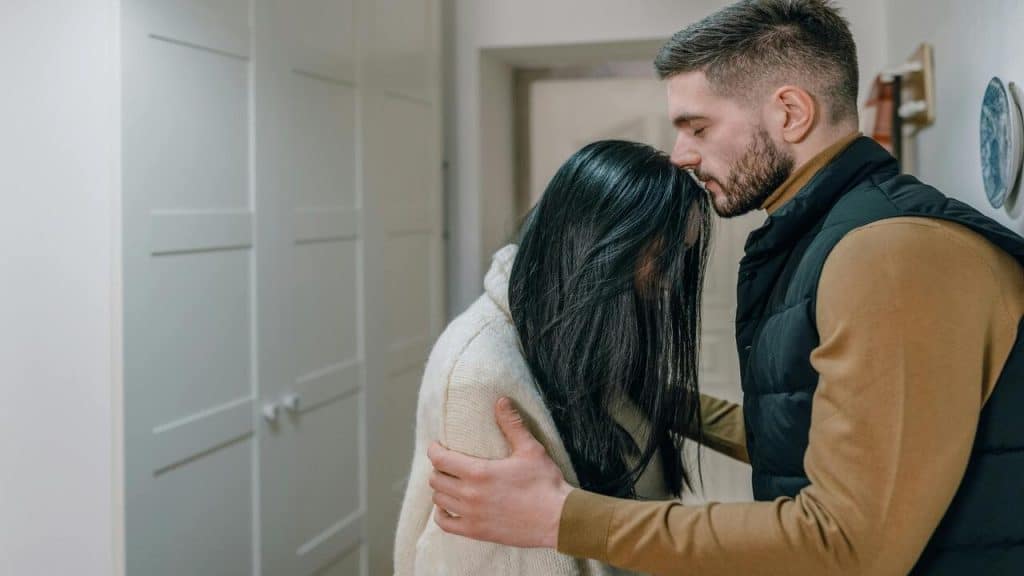 A man comforting his wife