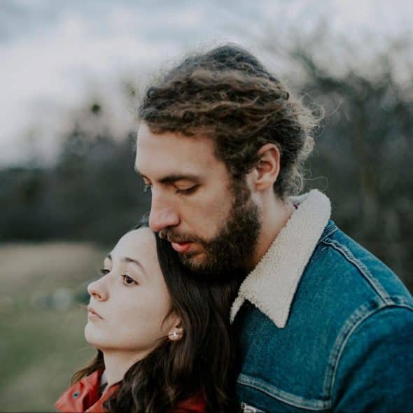 A man behind the woman for support
