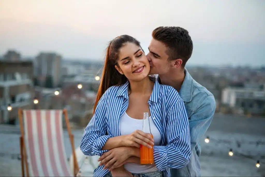 A man kissing a woman’s cheek
