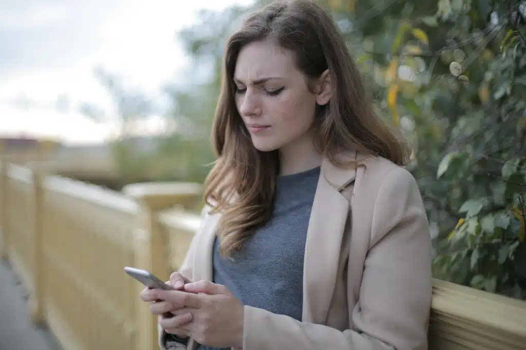 A woman using a smartphone.