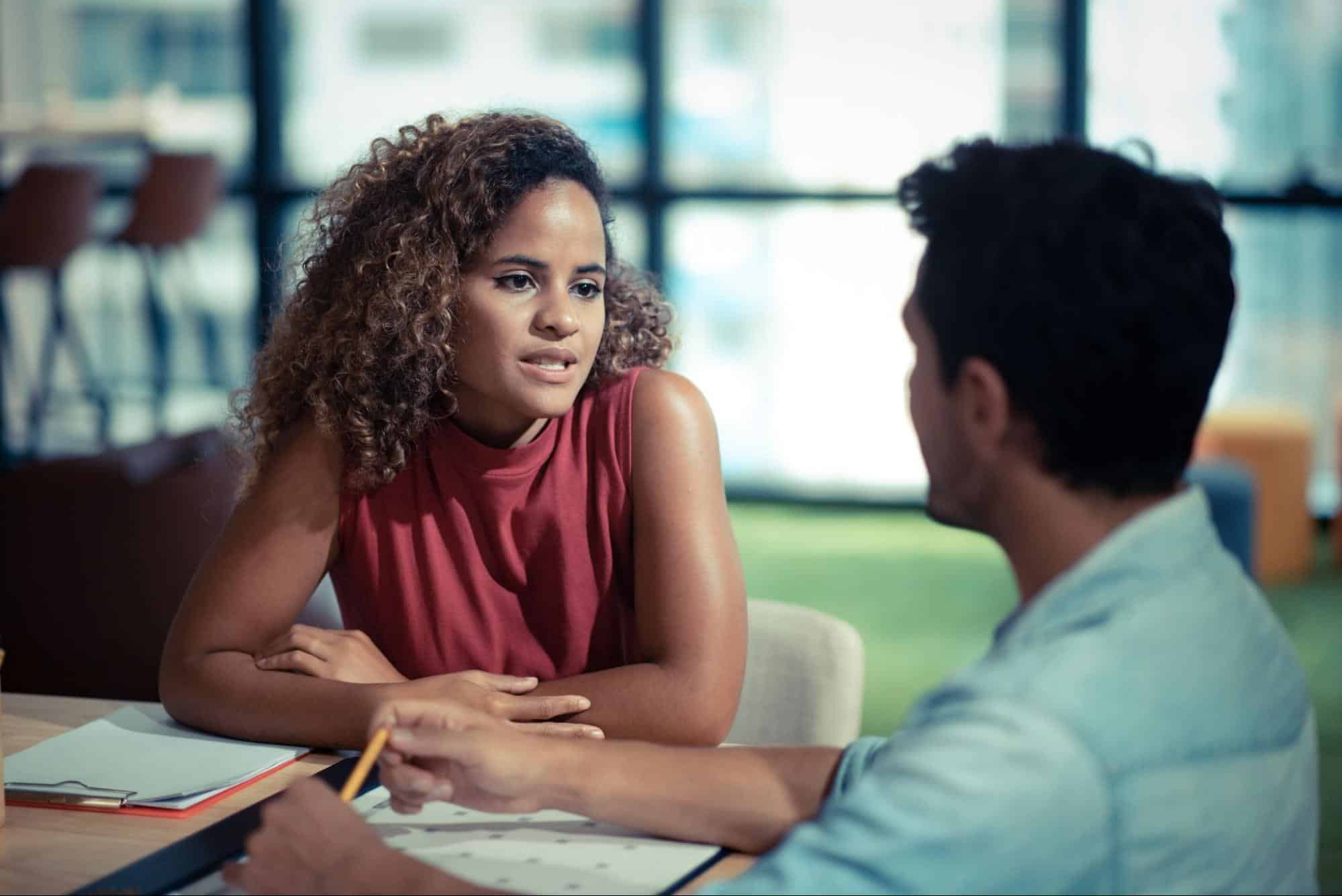 A man and woman talking 