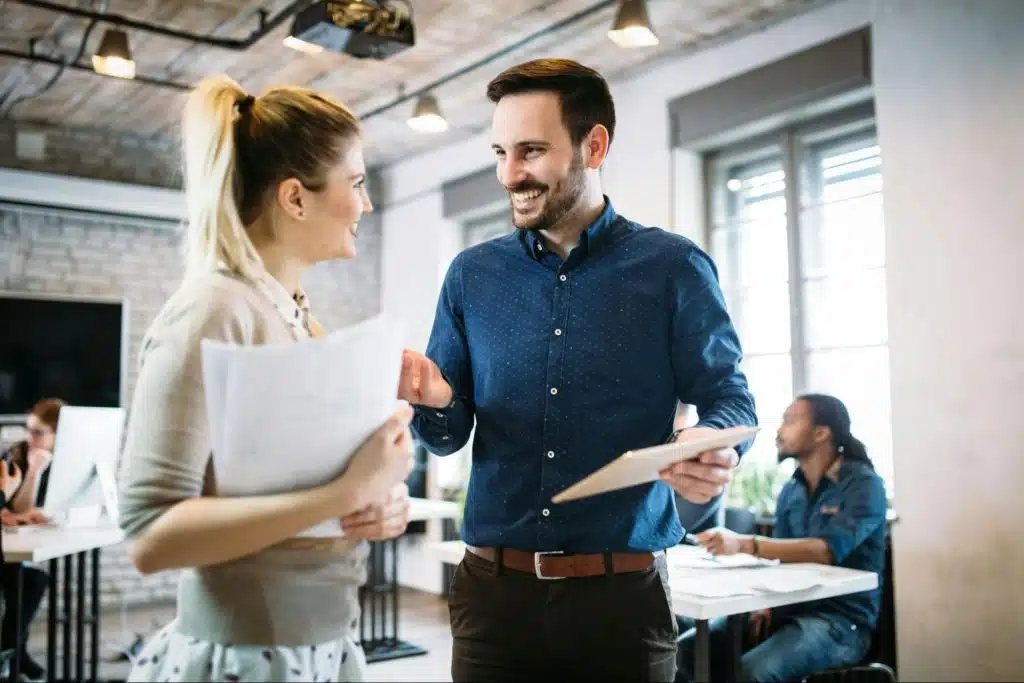 A man and woman smiling at each other