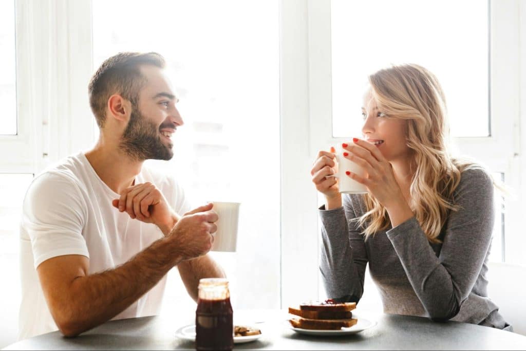 A man and woman looking at each other