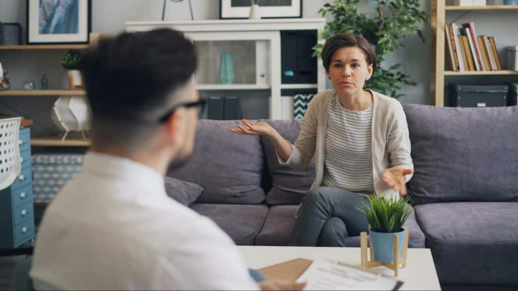 A man and woman talking about finance