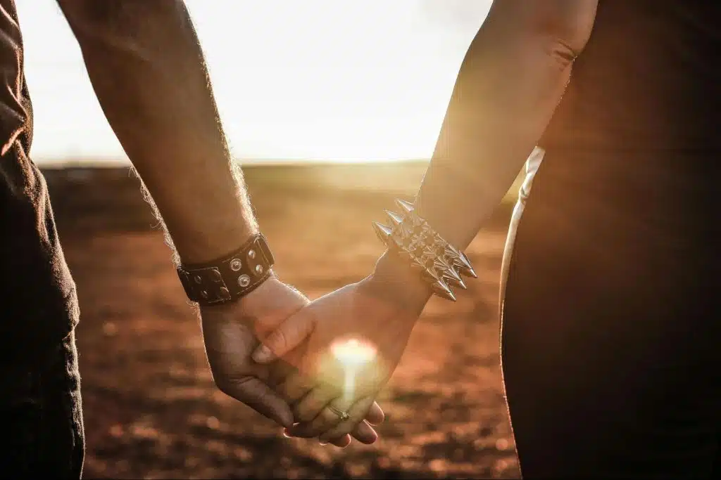 A man and woman holding hands