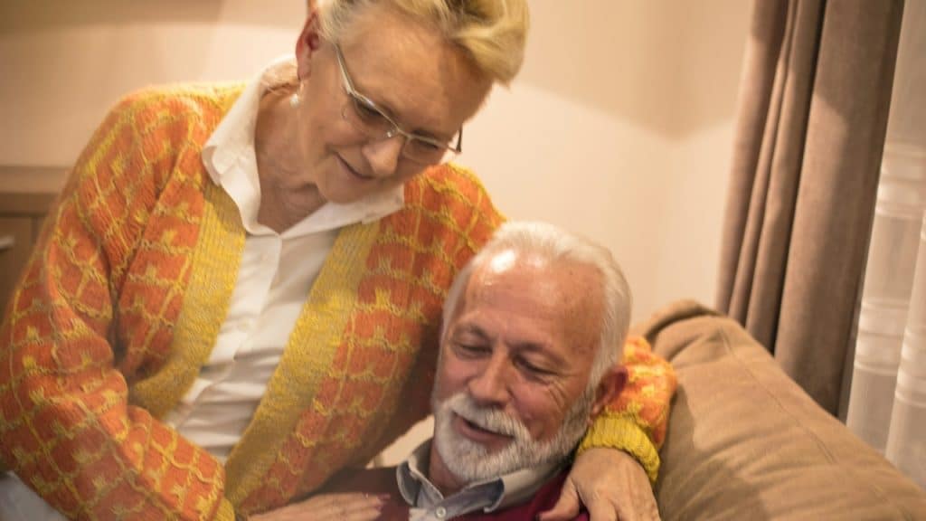 Senior couple using the phone.