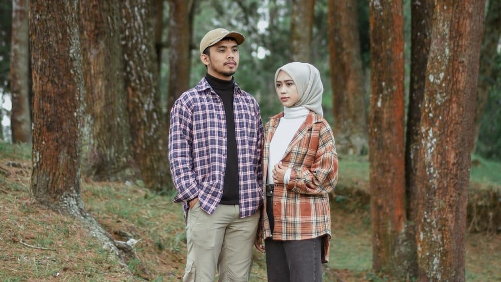 A man and a woman standing next to each other.