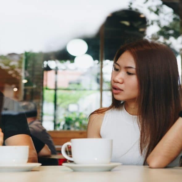 A man using his phone during a date