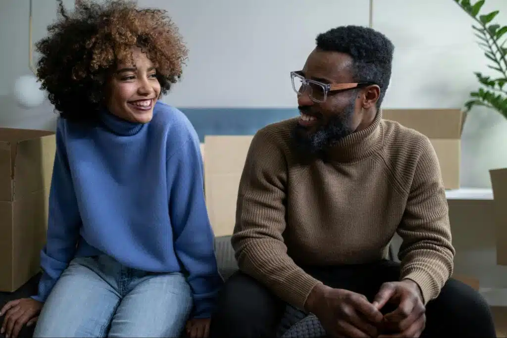 A man and woman smiling at each other