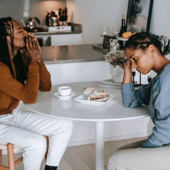 A couple arguing in the kitchen