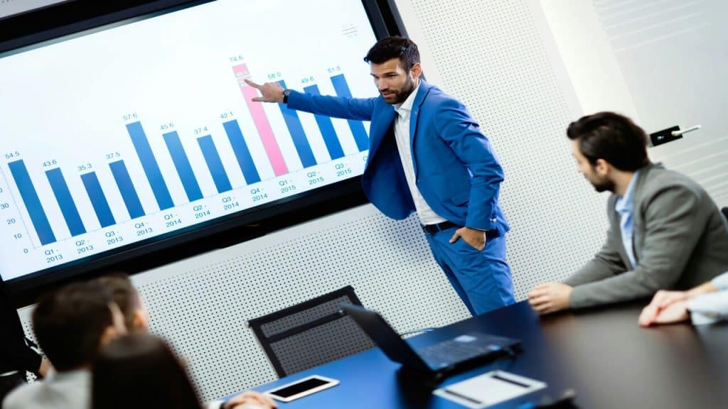 A man presenting at a business meeting