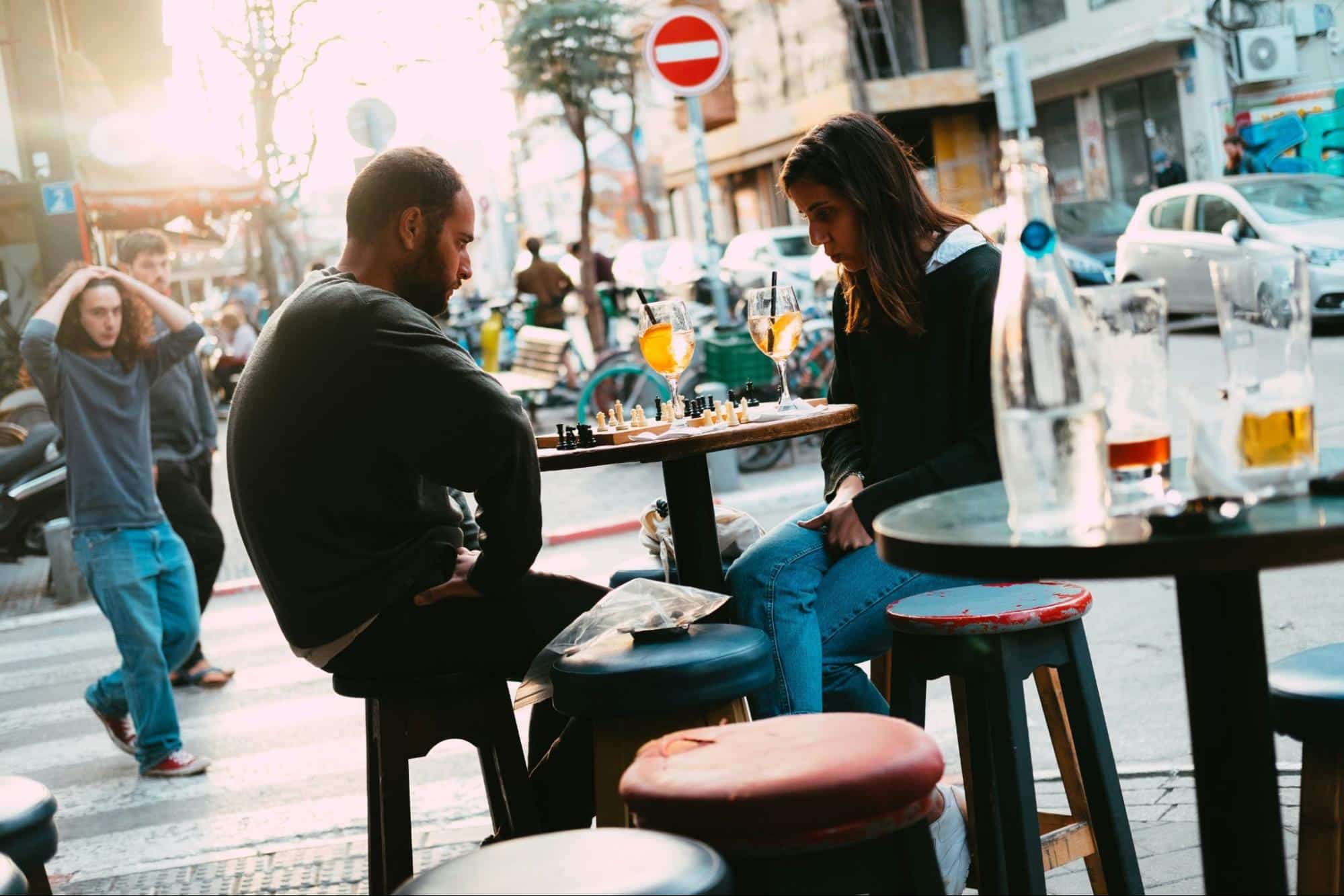 A man and woman outside having disagreements