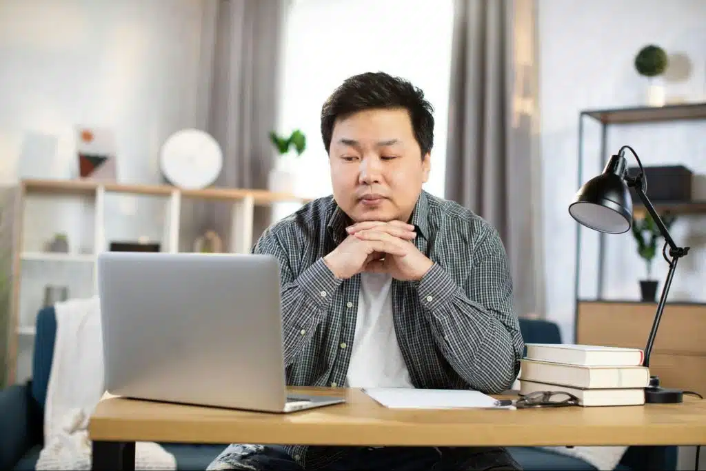 A man looking at the laptop