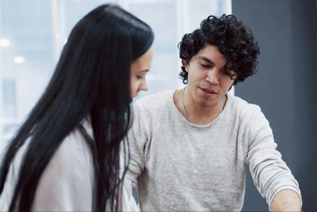 A man trying to help a woman