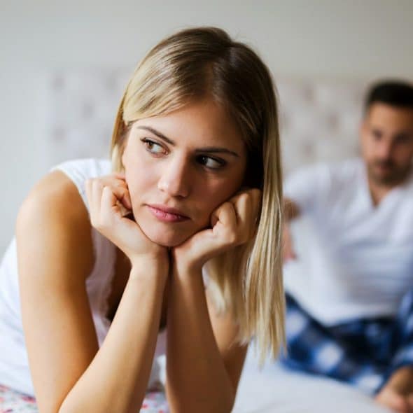 A young, unhappy couple having problems in their relationship.