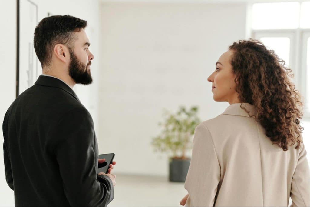 A woman looking at the man