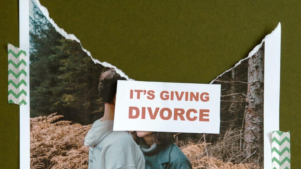 A couple in a forest with its giving-divorce sticker.