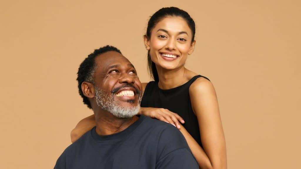 A smiling man and woman pose for a picture.
