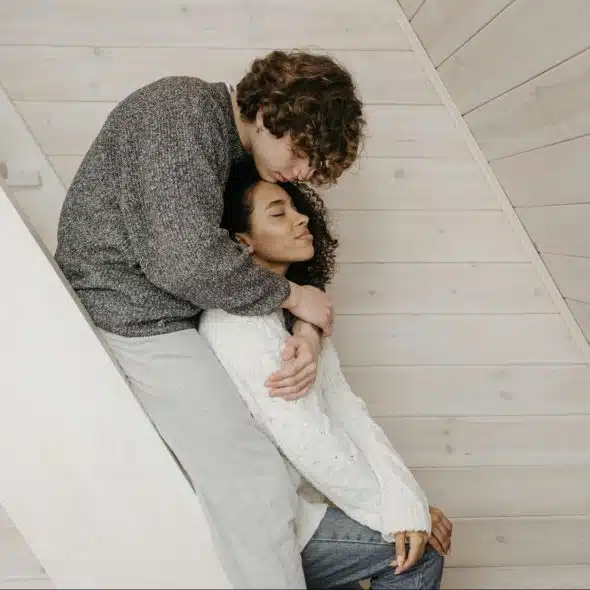 A man hugging a woman